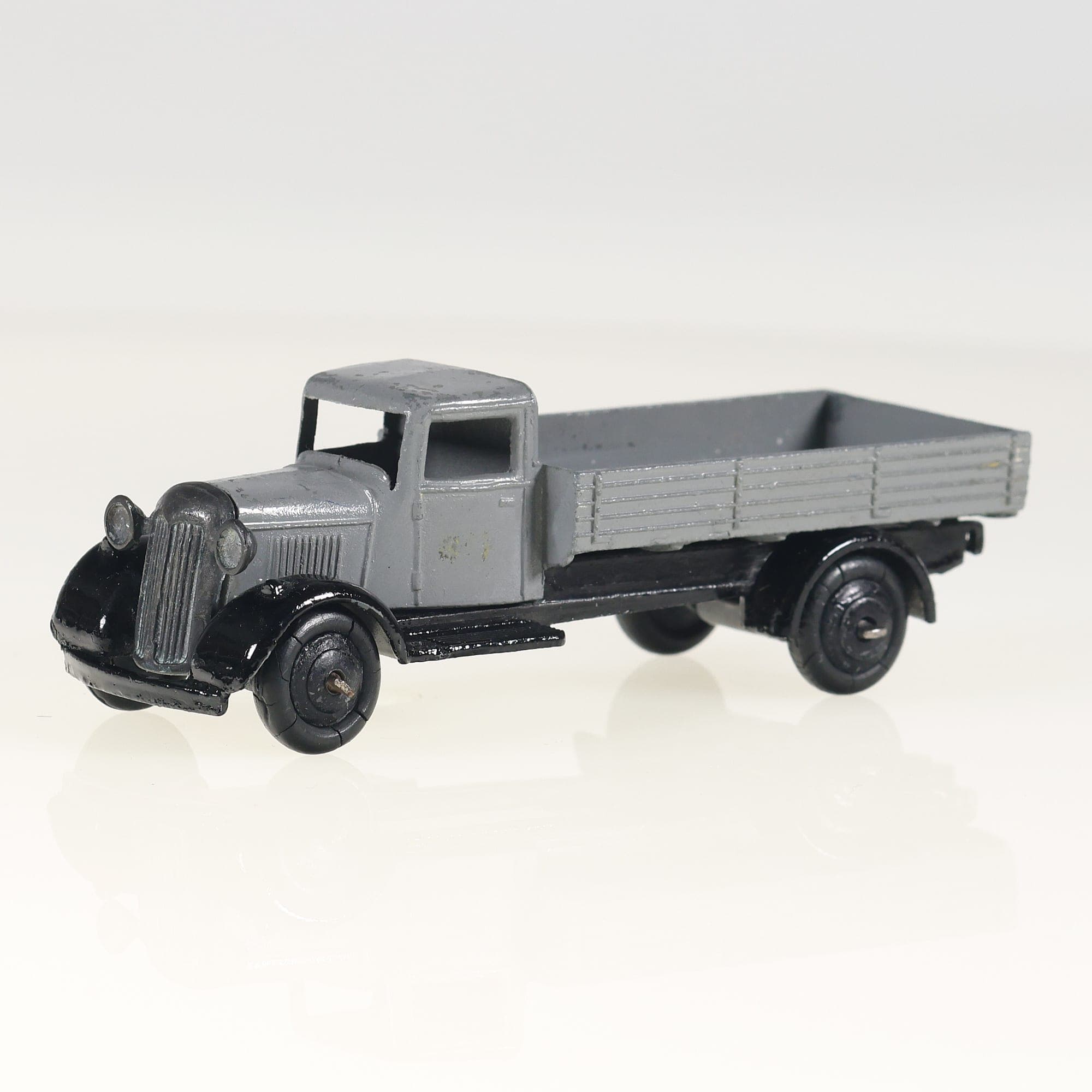Dinky Toys 25A camion plateau Camion plateau  1/50 Gris et noir Grade B sans boî