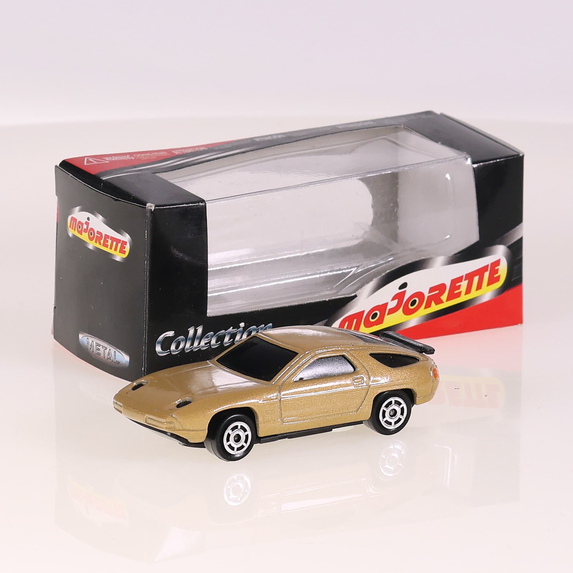 Norev Porsche 928 1/64 Beige avec boîte